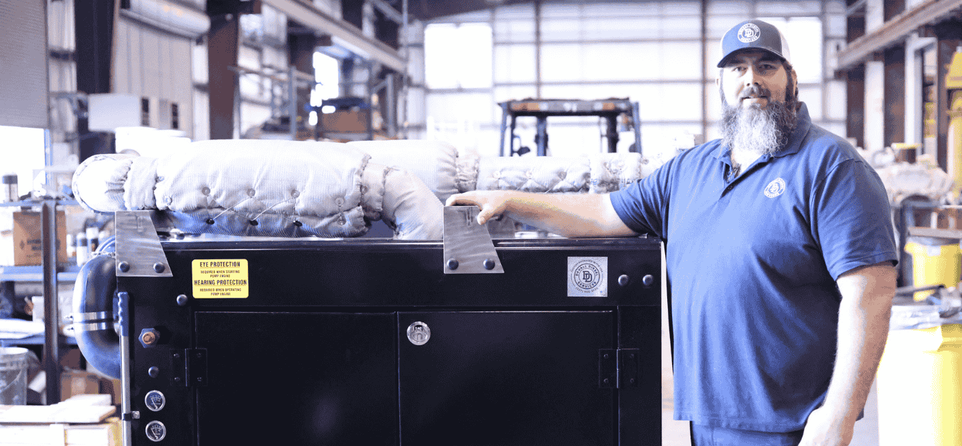 Two Devall Diesel Technicians assembling a generator frame